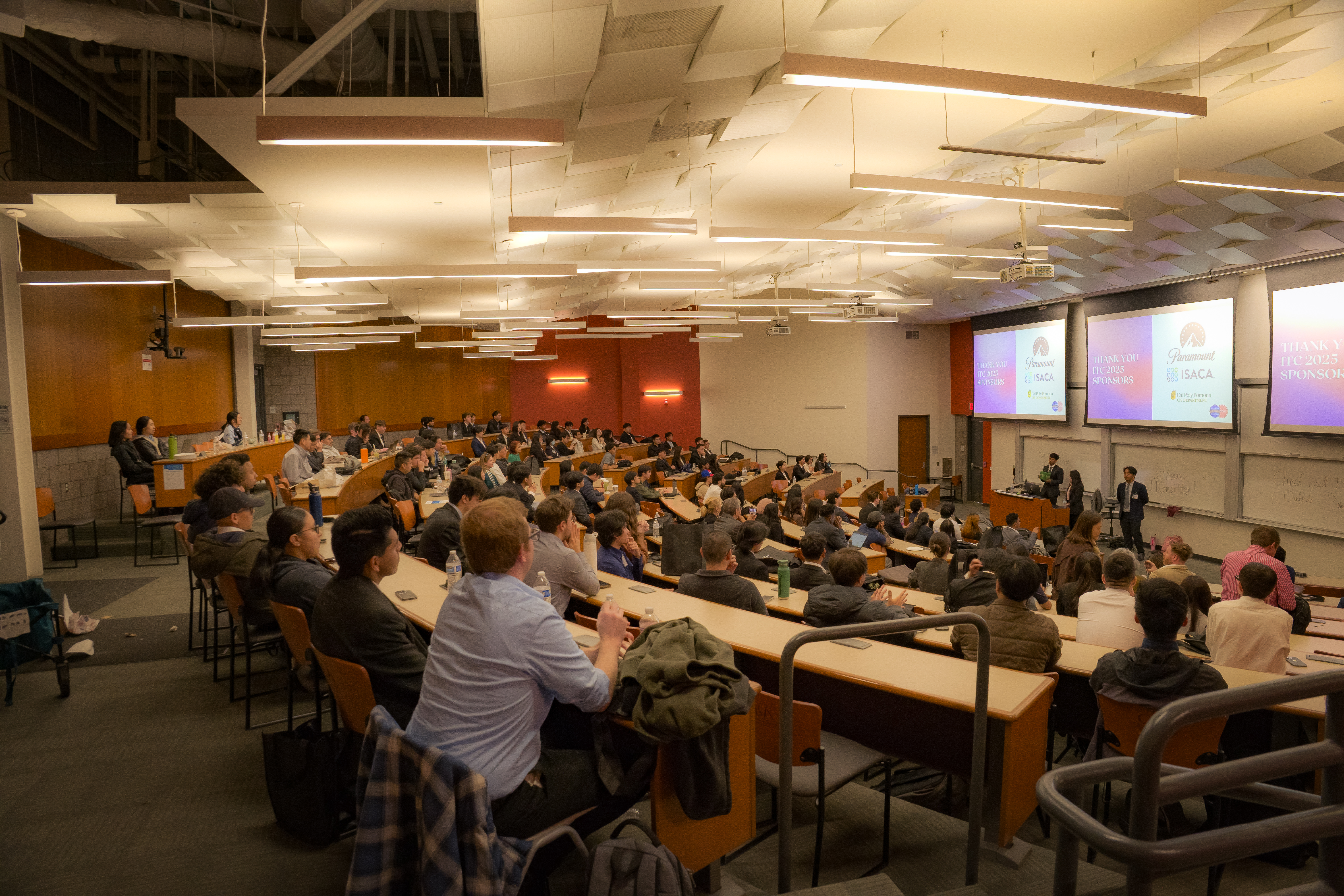 Many students watching a presentation at the end of ITC