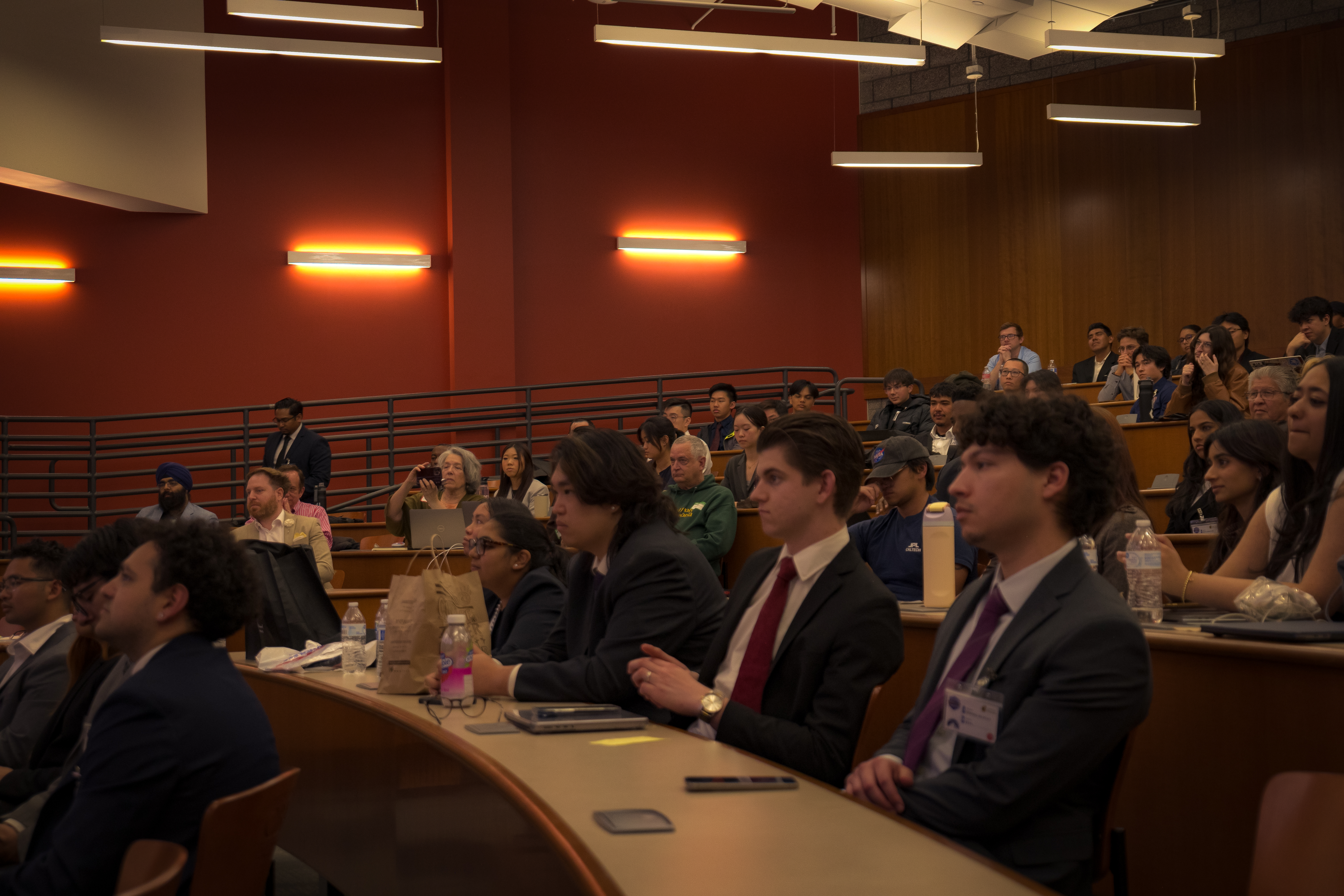 Close up of students sitting at long desks