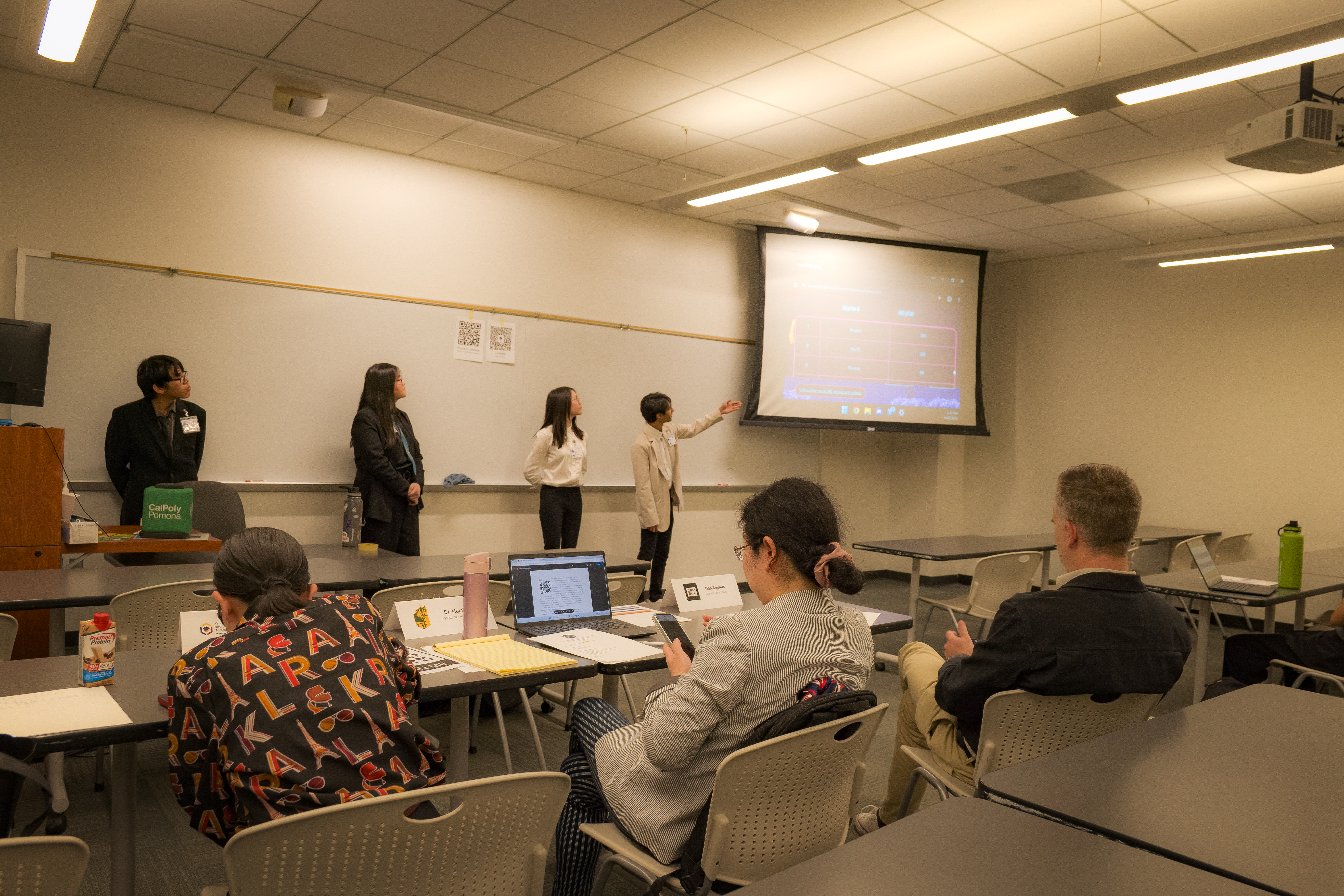 Four students presenting at ITC